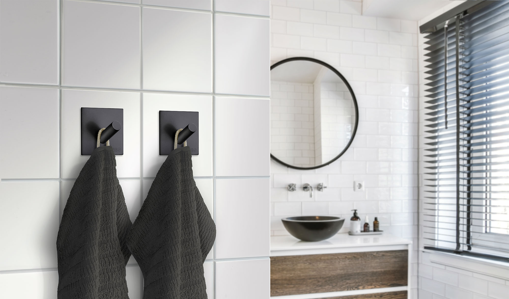 svarta självhäftande enkelkrokar med svarta handdukar i modernt vitt badrum